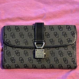 Vintage Dooney & Bourke wristlet.  Brown canvas with leather trim.